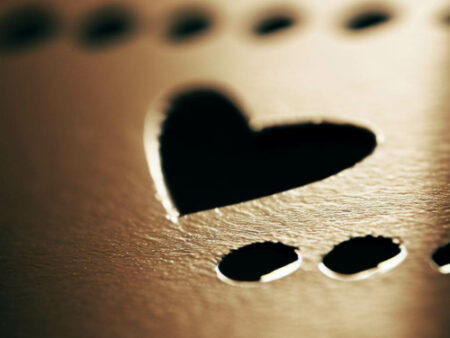 The Holes in Playing Cards and Their Remarkable Significance